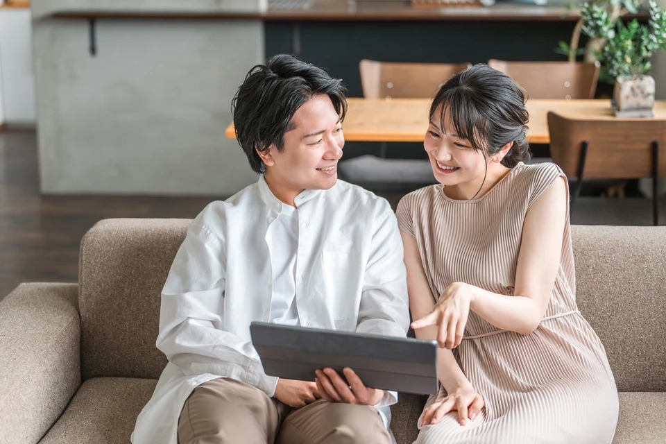 Modern interior living room features an sofa and decorative accessories against a white-colored wall- 3D rendering